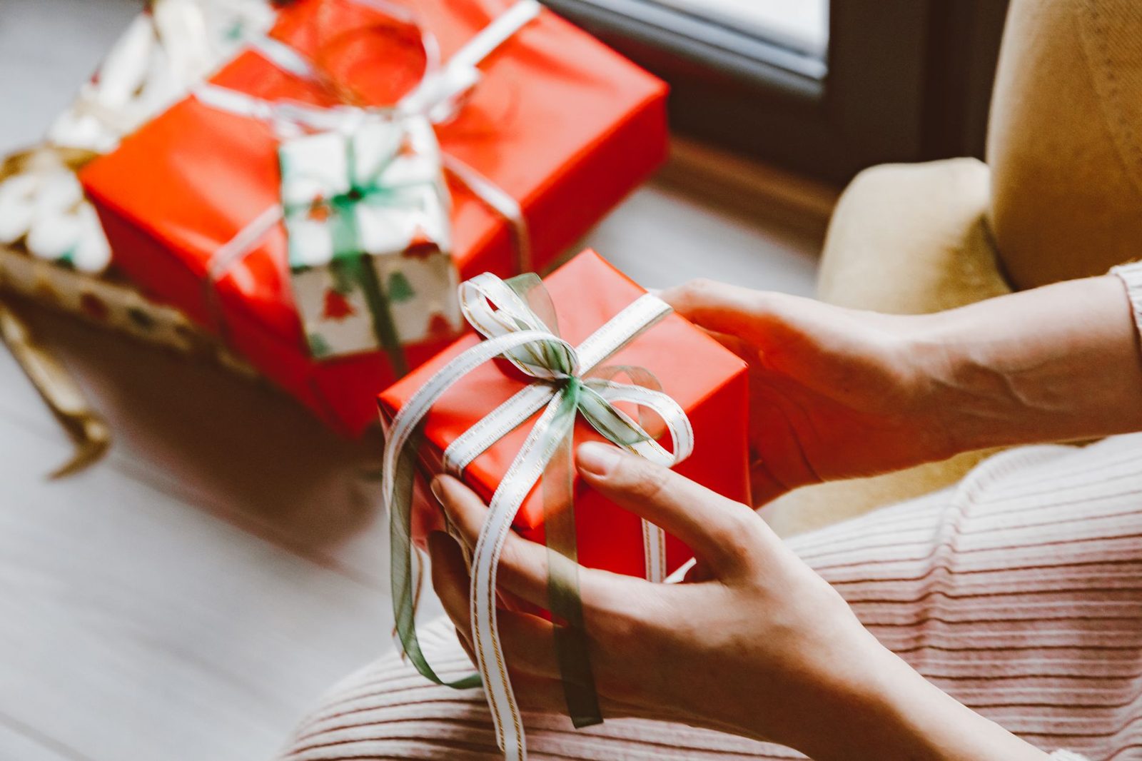 Hands holding a wrapped gift